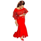 Red fish tail, puff sleeves, and gold waist belt.