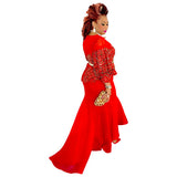 Red fish tail, puff sleeves, and gold waist belt.
